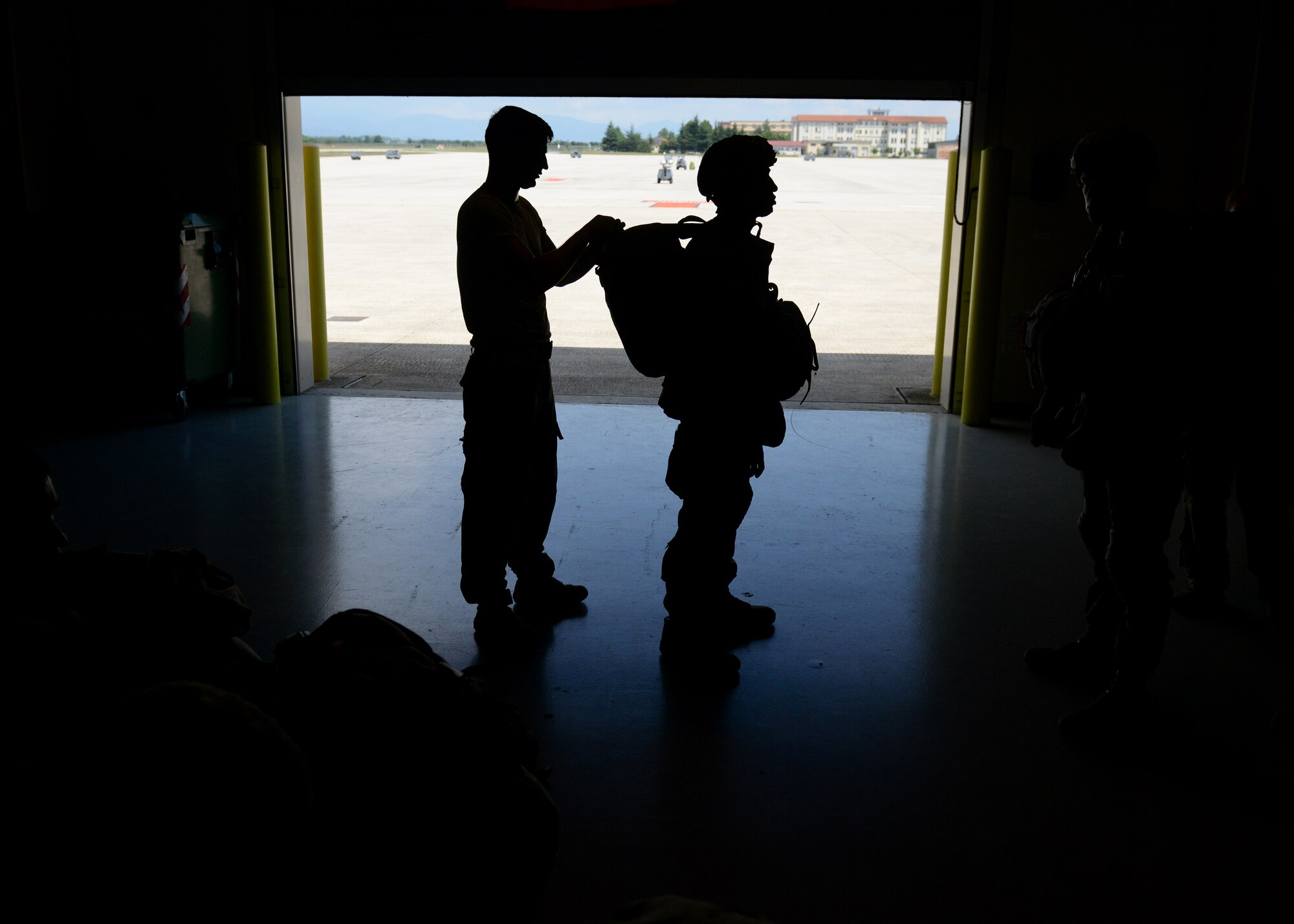 A U.S. Army 173rd Airborne Brigade paratrooper’s gear is inspected before airborne training operations July 27, 2016 at Aviano Air Base, Italy. The 173rd Airborne Brigade from Vicenza, Italy, is the Army Contingency Response Force in Europe. They are capable of projecting forces to conduct a full range of military operations across the United States European, Central and Africa Command areas of responsibility.  (U.S. Air Force photo by Tech. Sgt. Evelyn Chavez/Released)