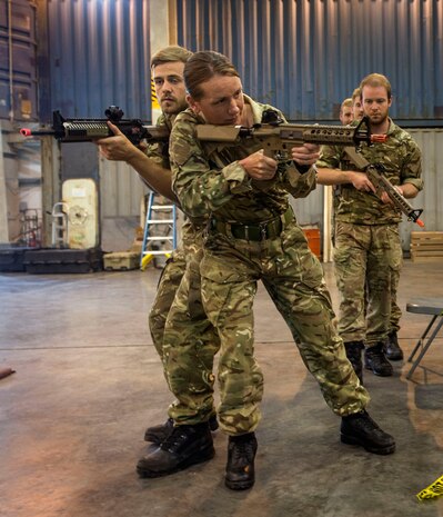 Coast Guardsman assigned to Patrol Forces Southwest Asia’s (PATFORSWA) maritime engagement team conduct close quarters combat training with British Royal Navy Sailors assigned to the Royal Navy Frigate HMS Portland (F79) in the U.S. 5th Fleet area of operations. The U.S. 5th Fleet compliments the counterterrorism activities of regional navies and coast guards through exercises, training and coordinated operations. (U.S. Navy Combat Camera photo by Mass Communication Specialist 2nd Class Sean Furey/Released)