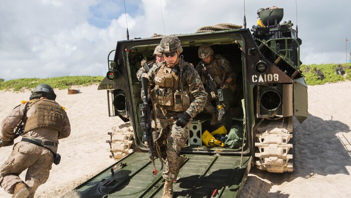 U.S. Marines with Company E, Battalion Landing Team 2nd Battalion, 3rd Marine Regiment, exit an Assault Amphibious Vehicle to assault a beach during Rim of the Pacific 2016. The assault was launched from USS San Diego and commanded by III Marine Expeditionary Force units aboard USS America.Twenty-six nations, more than 40 ships and submarines, more than 200 aircraft and 25,000 personnel are participating in RIMPAC from June 30 to Aug. 4, in and around the Hawaiian Islands and Southern California. 