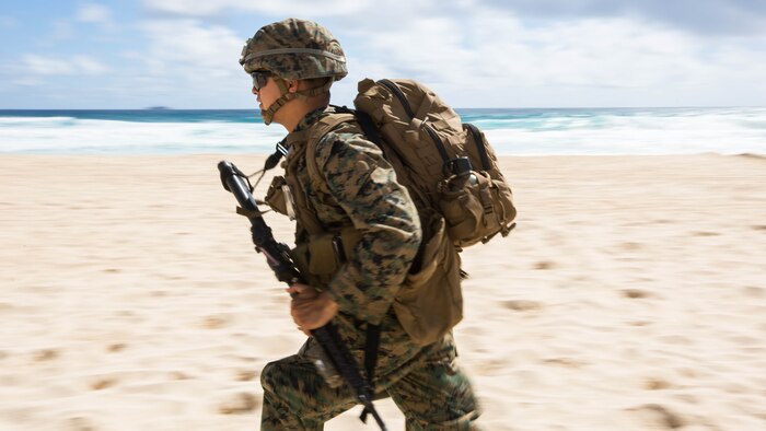 A U.S. Marine with Company E, Battalion Landing Team 2nd Battalion, 3rd Marine Regiment, assaults a beach during Rim of the Pacific 2016. Twenty-six nations, more than 40 ships and submarines, more than 200 aircraft and 25,000 personnel are participating in RIMPAC from June 30 to Aug. 4, in and around the Hawaiian Islands and Southern California. 