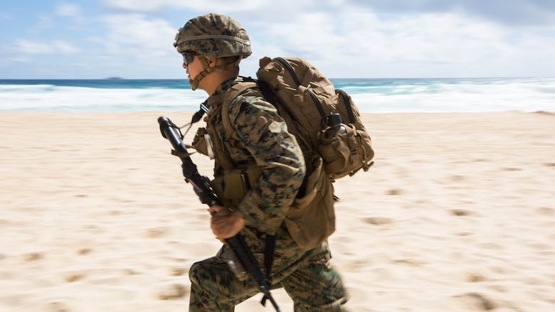 A U.S. Marine with Company E, Battalion Landing Team 2nd Battalion, 3rd Marine Regiment, assaults a beach during Rim of the Pacific 2016. Twenty-six nations, more than 40 ships and submarines, more than 200 aircraft and 25,000 personnel are participating in RIMPAC from June 30 to Aug. 4, in and around the Hawaiian Islands and Southern California. 