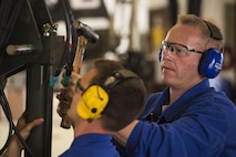 U.S. Air Force Col. Joseph McFall, 52nd Fighter Wing commander, right, assists Senior Airman Andrew Harmel, 52nd Logistic Readiness Squadron vehicle maintenance technician, fix a deicing truck at Spangdahlem Air Base, Germany, July 28, 2016. The 52nd Fighter Wing commander and command chief had the opportunity to work alongside and learn firsthand what 52nd LRS, vehicle management special purpose shop Airmen do. (U.S. Air Force photo by Staff Sgt. Jonathan Snyder/Released)