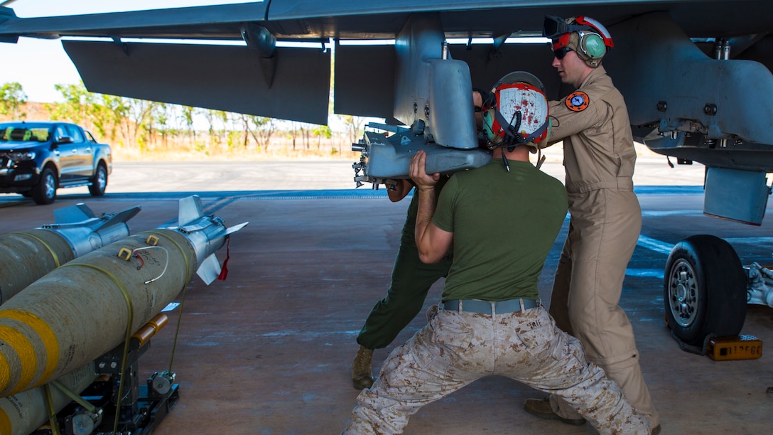 Staff Sgt. Jerrod Gelbaugh, the ordnance staff noncommissioned officer in charge with Marine Fighter Attack Squadron 122, assists Cpl. Mark Tate, an aviation ordnance technician with VMFA-122, remove a Bomb Rack Unit 55 from an F/A-18C during exercise Southern Frontier at Royal Australian Air Force Base Tindal, Australia, July 28, 2016. Southern Frontier is three weeks of unit level training helping the squadron gain experience and qualifications in low altitude, air-ground, high explosive ordnance delivery at the unit level. VMFA-122 is home based out of Marine Corps Air Station Beaufort, South Carolina and are currently assigned to MAG-12 at MCAS Iwakuni under the Unit Deployment Program. 