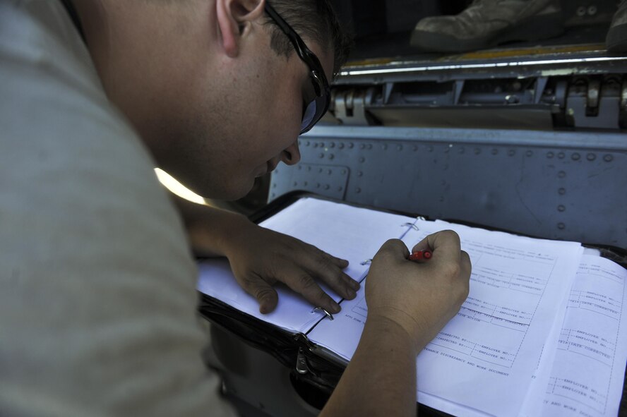 Senior Airman Thomas Miller, a crew chief with the 4th Aircraft Maintenance Unit, completes a checklist as part of his duties at Hurlburt Field, Fla., July 20, 2016. As a crew chief, Miller conducts general maintenance to ensure the safety of the flight crew while developing a general knowledge of several responsibilities. (U.S. Air Force photo by Airman Dennis Spain)