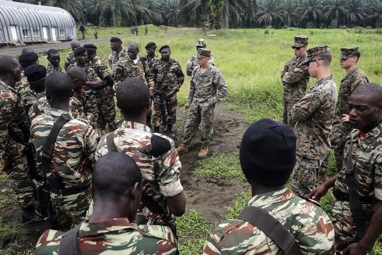 Marines with Special Purpose Marine Air-Ground Task Force Crisis Response-Africa, prepare to conduct practical application with Cameroonian soldiers with Forces Fusiliers Marins et Palmeurs de Combat on fire team formations and patrols in Limbé, Cameroon, June 27, 2016.  Marines share tactics, techniques and skills with the FORFUMAPCO soldiers to combat the illicit trafficking in Cameroon.  (U.S. Marine Corps photo by Cpl. Alexander Mitchell/released)