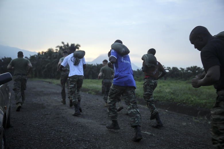 Marines with Special Purpose Marine Air-Ground Task Force Crisis Response-Africa, run with Cameroonian soldiers with Forces Fusiliers Marins et Palmeurs de Combat during an early morning physical training in Limbé, Cameroon, June 29, 2016.  Marines share tactics, techniques and skills with the FORFUMAPCO soldiers to combat the illicit trafficking in Cameroon.  (U.S. Marine Corps photo by Cpl. Alexander Mitchell/released)