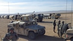 Soldiers assigned to the 548th Transportation Company, 311th Brigade Support Battalion, Missouri National Guard, headquartered in Trenton, Missouri, prepare for one of over 40 tactical convoy training missions during their training at the National Training Center in Fort Irwin, California. 