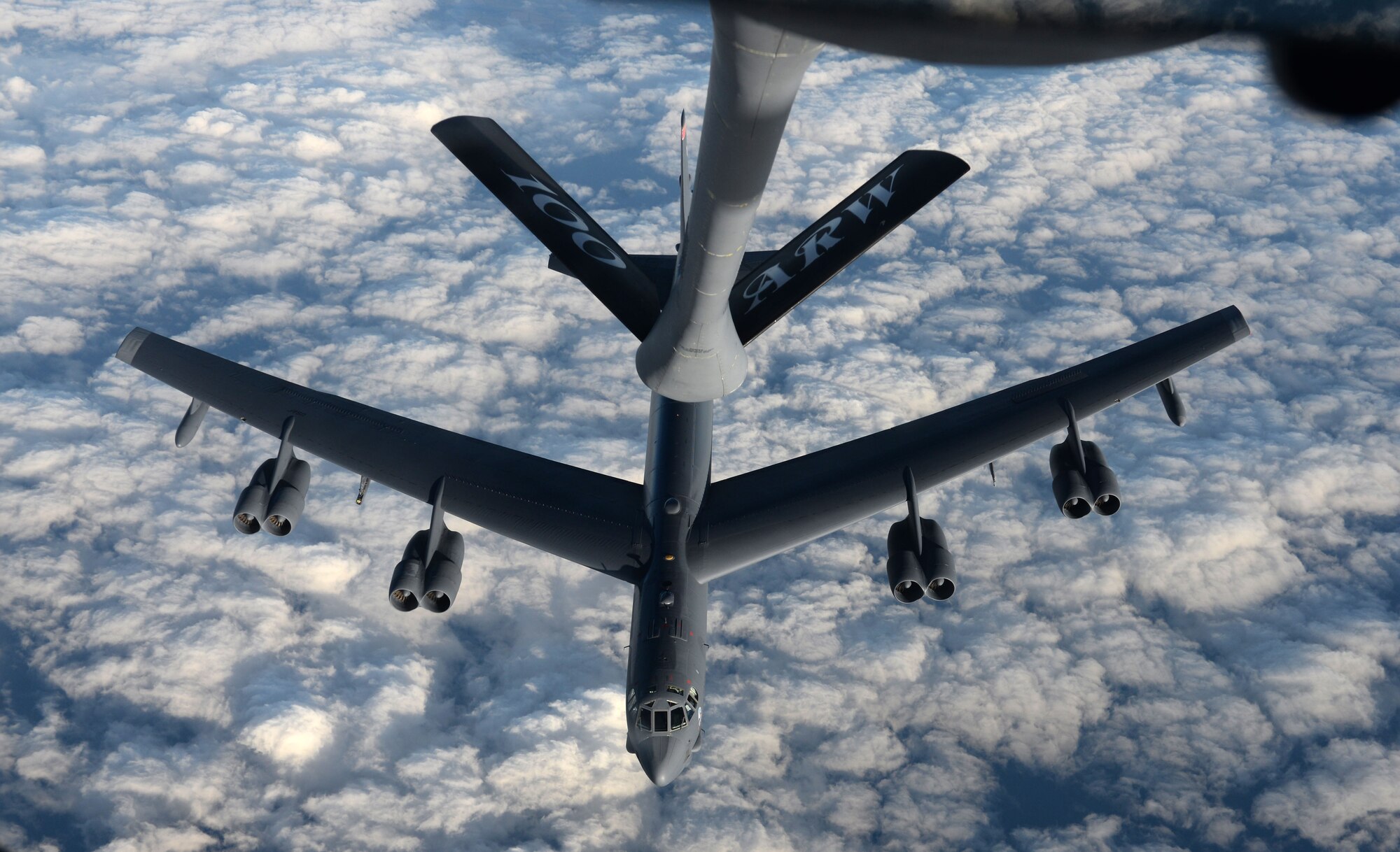 A KC-135 Stratotanker from RAF Mildenhall, England, refuels a B-52 Stratofortress from Minot Air Force Base, North Dakota, in support of Operation Polar Roar over Scotland, Aug. 1, 2016. Polar Roar is a U.S. Strategic Command operation designed to strengthen bomber crews' interoperability and demonstrate ability for the U.S. bomber force to provide flexible and vigilant long-range global-strike capability. (U.S. Air Force photo by Staff Sgt. Kate Thornton)