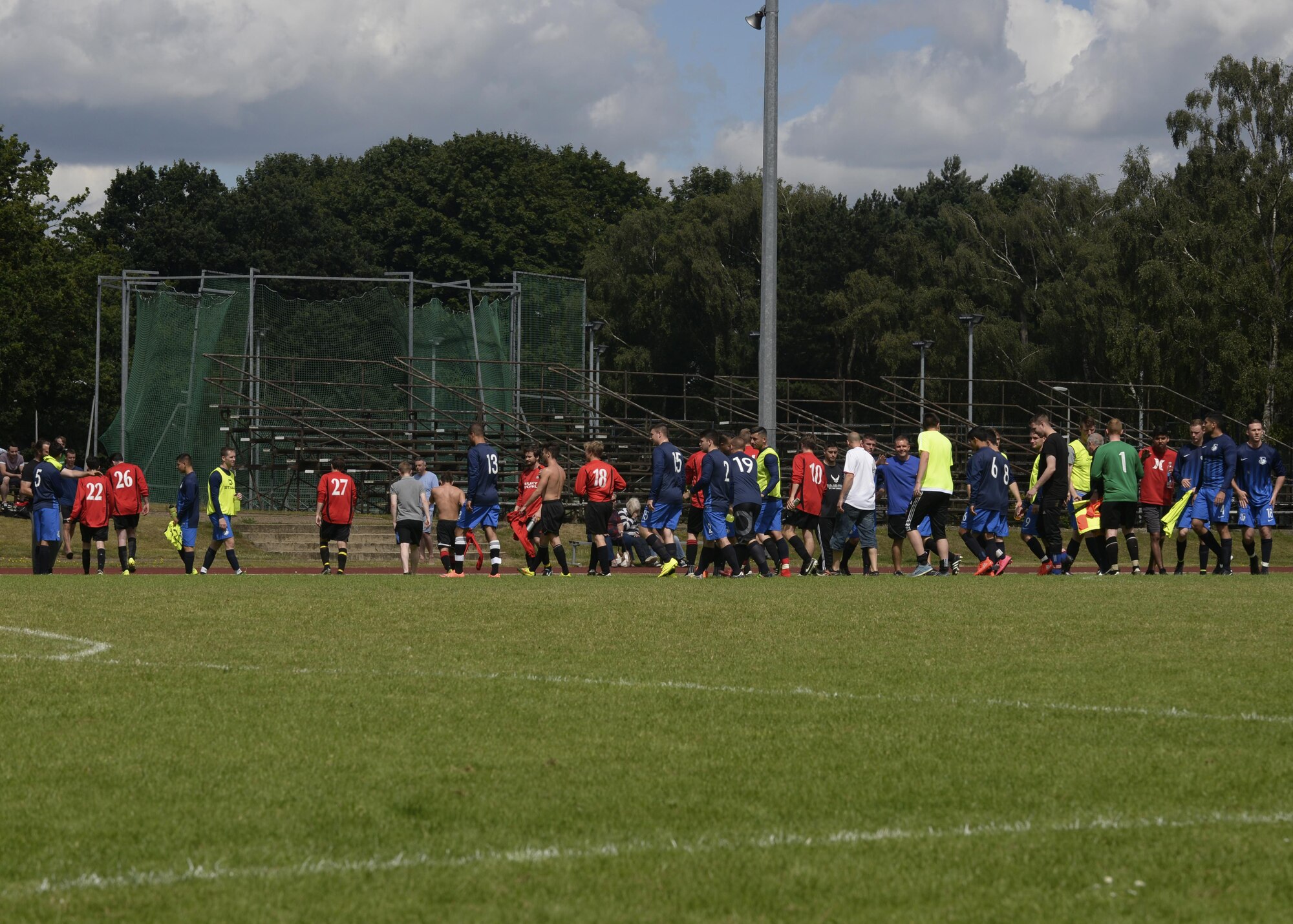 Members of the Liberty Football Club and Bury Bowl Football Club shake hands after an English football match at Royal Air Force Lakenheath, England, July 31. Liberty Football Club defeated the Bury Bowl Football Club 8-to-2, during their first game of the season. (U.S. Air Force photo/Airman 1st Class Abby L. Finkel)