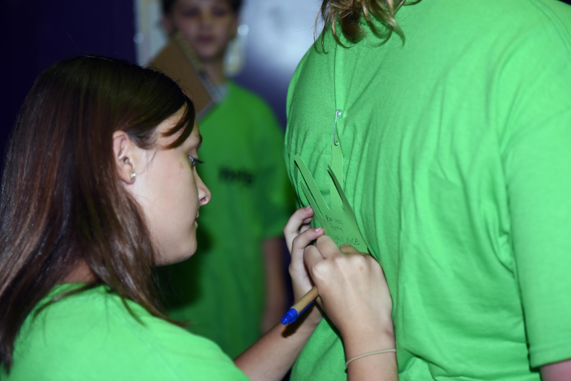 Make It Better 4 Teens campers write down something nice about each student during a social pillar exercise, July 25, 2016, at Seymour Johnson Air Force Base, North Carolina. The MIB4T camp focused on the four pillars of comprehensive Airman fitness to teach youth some of the same resilience techniques military members receive. (U.S. Air Force photo/Airman 1st Class Ashley Williamson)