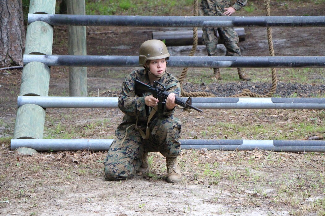 FMTB-E student participates on the obstacle course.  The obstacle is designed to test students strength and ability to safely move past obstacles.