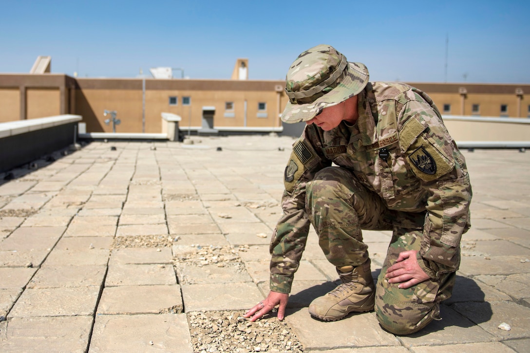 Air Force Master Sgt. Jana Madrid checks roof blast tiles on Craig-Joint Theater Hospital at Bagram Airfield, Afghanistan, July 23, 2016. Madrid is a biomedical equipment technician and facility manager assigned to the 455th Expeditionary Medical Group. Air Force photo by Senior Airman Justyn M. Freeman 