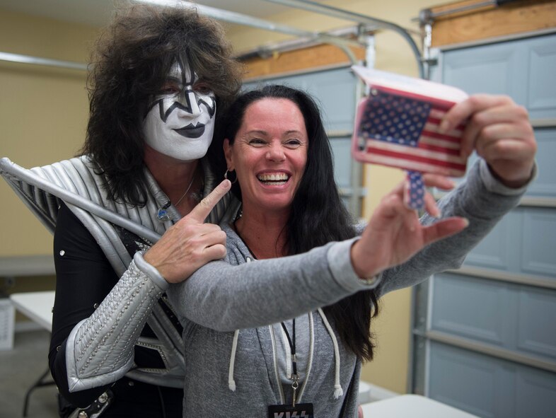 Christa Leary and Tommy Thayer, Kiss lead guitarist, pose for a selfie. (Staff Sgt. Christopher Ruano)