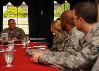 Chief Master Sgt. of the Air Force James A. Cody has a discussion with Airmen during a meet and greet in the Thunderbird room located at the club on Nellis Air Force Base, Nev., July 27, 2016. While meeting with Airmen, Cody discussed Air Force topics that may relate to an Airmen’s career field and asked Airmen their opinions on how to make the Air Force better as a whole. (U.S. Air Force photo by Senior Airman Jake Carter/Released)