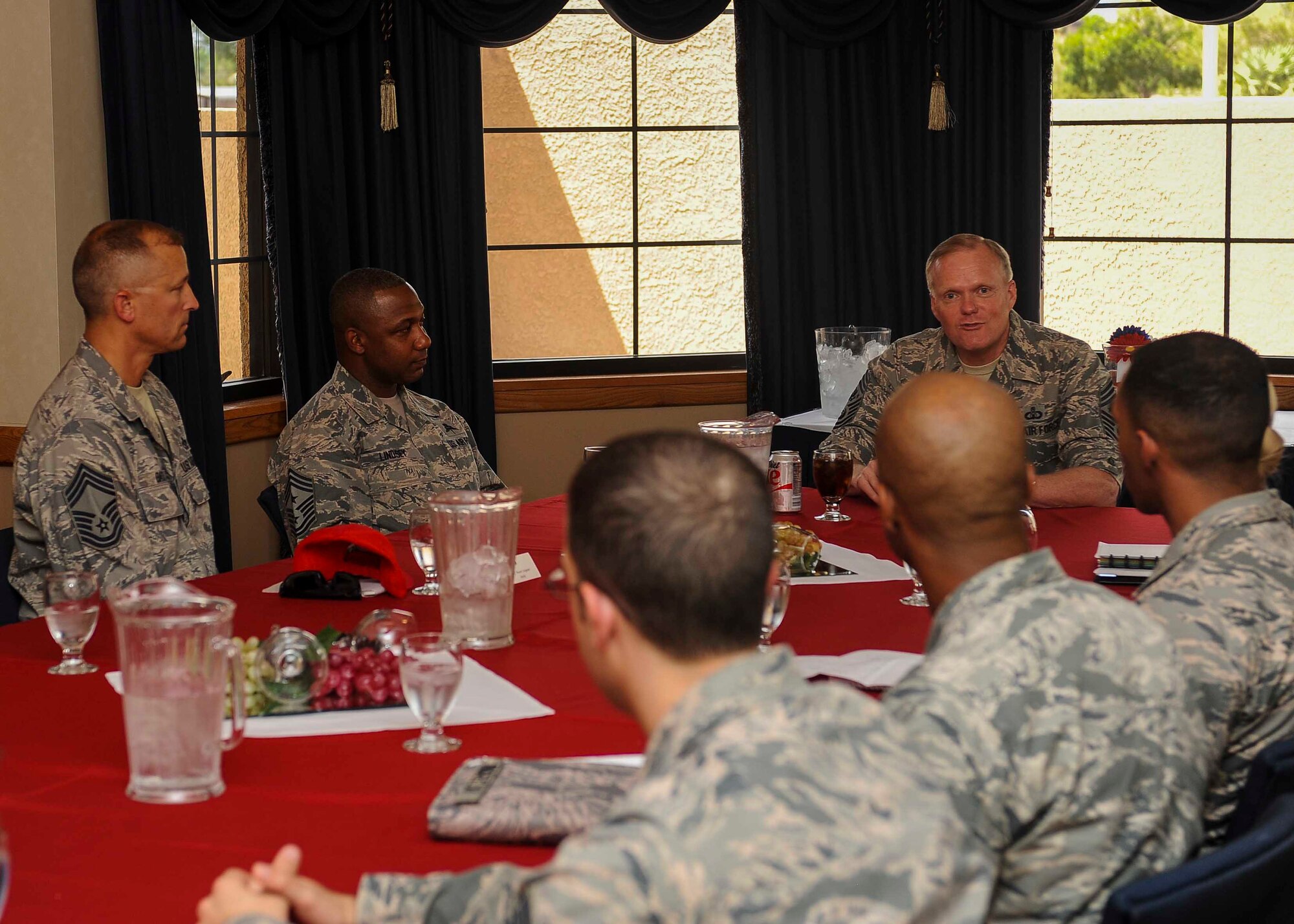 Chief Master Sgt. of the Air Force James A. Cody has a discussion with Airmen during a meet and greet in the Thunderbird room located at the club on Nellis Air Force Base, Nev., July 27, 2016. While meeting with Airmen, Cody expressed his thanks to Airmen for their service and how they will be leading the force of the future while the Air Force continues to evolve in air, space and cyberspace. (U.S. Air Force photo by Senior Airman Jake Carter/Released)