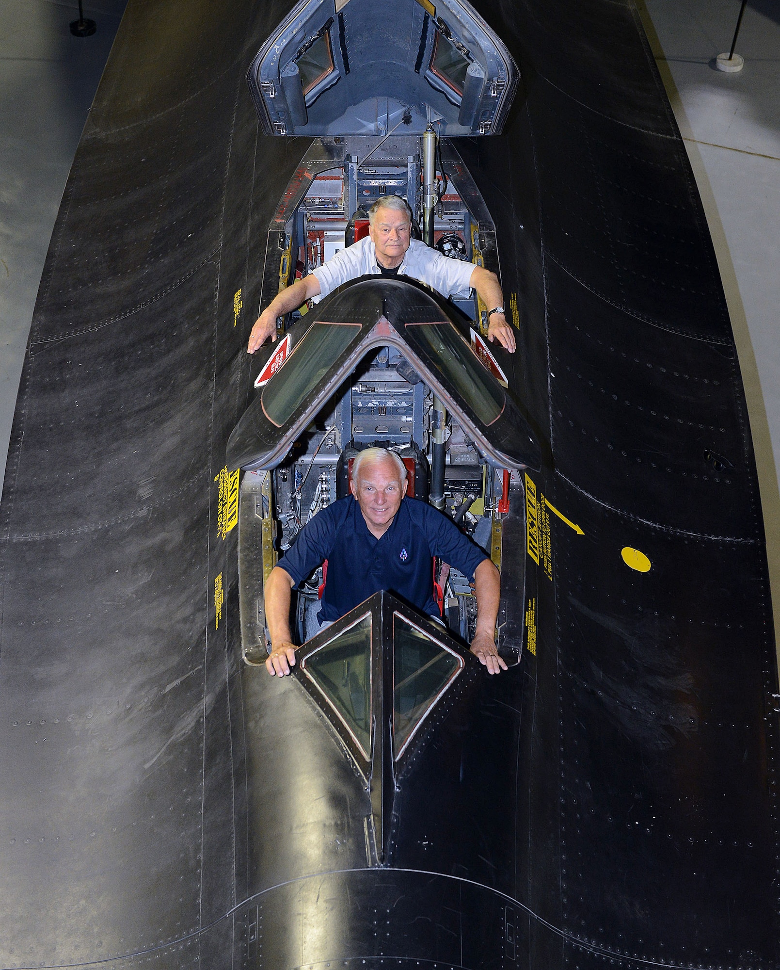 Maj. Gen. Eldon “Al” Joersz, USAF pilot retired, front, and Lt. Col. George “GT” Morgan, USAF retired reconnaissance systems officer, sit inside the cockpit of the SR-71 aircraft they flew when setting the world absolute speed record for jet-powered aircraft on July 28, 1976. The two were at the Museum of Aviation in Warner Robins, Georgia for the 40th anniversary of the historic flight. (U.S. Air Force photo by Tommie Horton/Released)