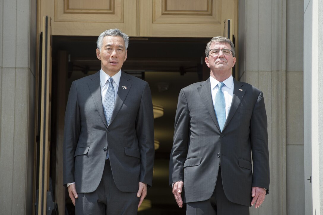 Defense Secretary Ash Carter greets Prime Minister of Singapore Lee Hsien Loong at the Pentagon in Washington, D.C., Aug. 1, 2016. DoD photo by Air Force Tech. Sgt. Brigitte N. Brantley