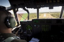 U.S. Air Force Capt. Trevor Millette, 71st Rescue Squadron pilot, flies an HC-130J Combat King II towards the unimproved landing zone on Bemiss Field, July 29, 2016, over Grand Bay Bombing and Gunnery Range, Ga. This flight marked the first time an HC-130J landed at the ULZ on Bemiss Field, which was previously used for airdrops and helicopter landings. The landing validated the pilot’s training for future operations in austere locations and met requirements for training that cannot be accomplished on paved runways or assault strips. (U.S. Air Force photo by Staff Sgt. Ryan Callaghan)
