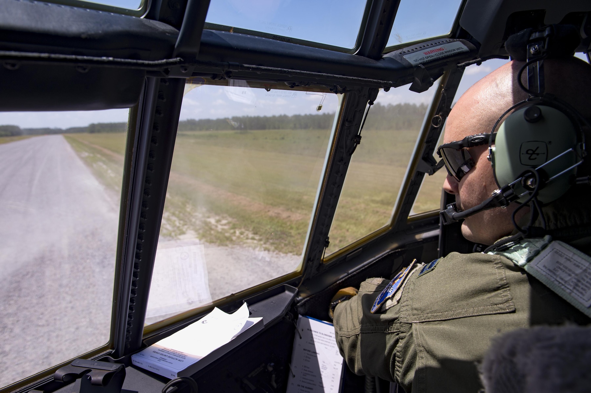 U.S. Air Force Capt. Trevor Millette, 71st Rescue Squadron pilot, taxis an HC-130J Combat King II on the unimproved landing zone on Bemiss Field, July 29, 2016, at Grand Bay Bombing and Gunnery Range, Ga. This flight marked the first time an HC-130J landed at the ULZ on Bemiss Field, which was previously used for airdrops and helicopter landings. The landing validated the pilot’s training for future operations in austere locations and met requirements for training that cannot be accomplished on paved runways or assault strips. (U.S. Air Force photo by Staff Sgt. Ryan Callaghan)
