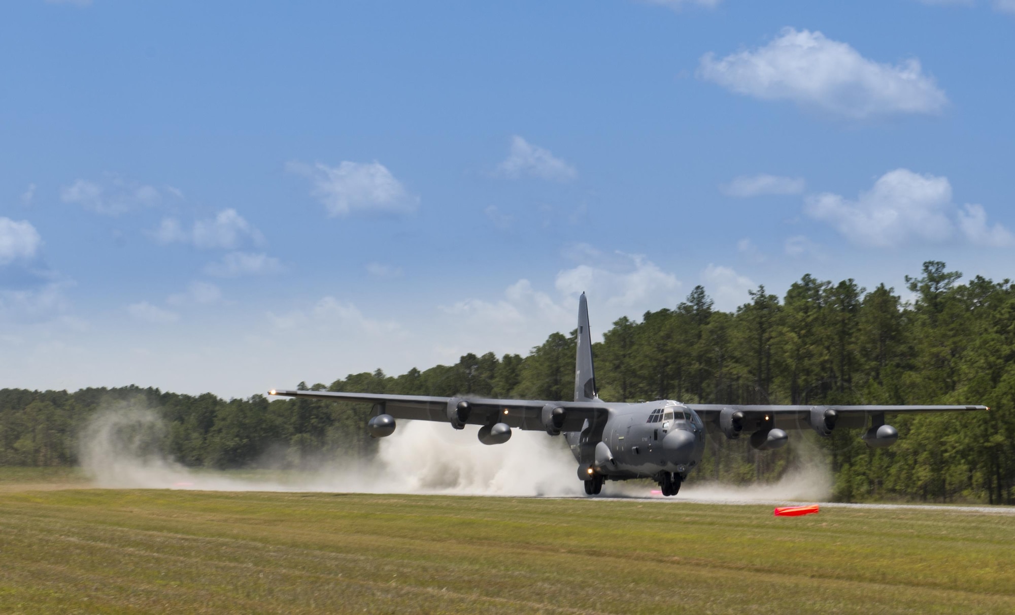 An HC-130J Combat King II from the 71st Rescue Squadron lands on the Bemiss Field unimproved landing zone, July 29, 2016, at Grand Bay Bombing and Gunnery Range, Ga. This flight marked the first time an HC-130J landed at the ULZ on Bemiss Field, which was previously used for airdrops and helicopter landings. The landing validated the pilot’s training for future operations in austere locations and met requirements for training that cannot be accomplished on paved runways or assault strips. (U.S. Air Force photo by Tech. Sgt. Zachary Wolf)
