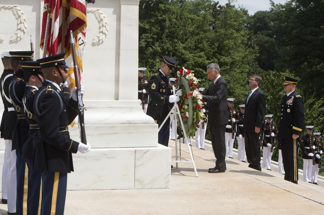 Defense Secretary Ash Carter, second from right, looks on as Singapore Prime Minister Lee Hsien Loong lays a wreath at the Tomb of the Unknown Soldier in Arlington National Cemetery in Virginia., Aug. 1, 2016. The two leaders met to discuss matters of mutual importance. DoD photo by Navy Petty Officer 1st Class Tim D. Godbee