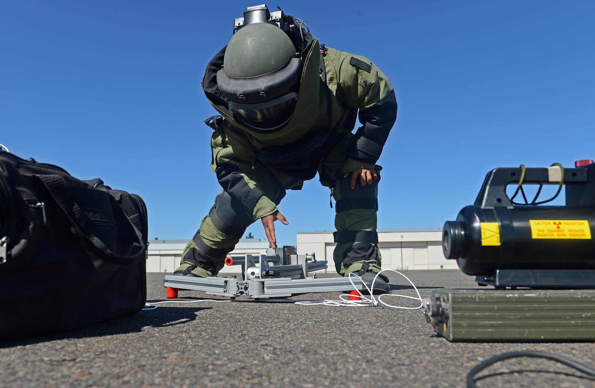 Staff Sgt. Isaac Martinez, 787th Explosive Ordnance Disposal team lead, positions the camera for an X-ray of a simulated improvised explosive device during Cascade Helix, July 27, 2016 on McChord Field, Wash. The 787th EOD company and members of the JBLM Director of Emergency Services responded to conduct an improvised explosive device response. (U.S. Air Force photo/Senior Airman Divine Cox)
