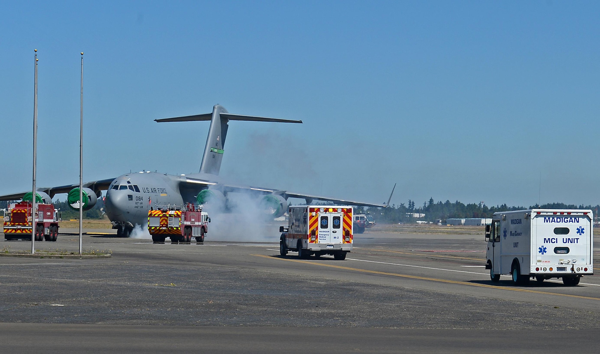 Joint Base Lewis McChord first responders respond to a simulated McChord C-17 Globemaster III aircraft mishap during Cascade Helix, July 27, 2016 on McChord Field, Wash. The C-17 aircraft mishap kicked off the beginning of the mass casualty scenario of the exercise. (U.S. Air Force photo/Senior Airman Divine Cox)