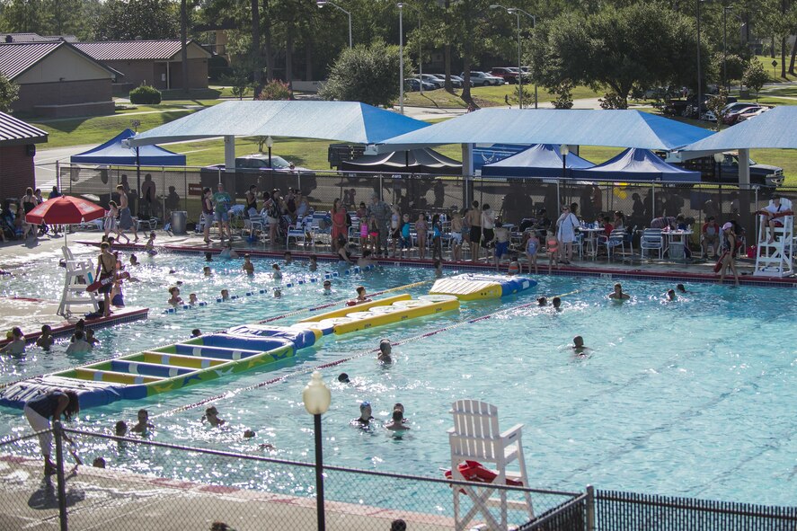 End of Summer Bash attendees spend an afternoon by the pool, July 29, 2016, at Moody Air Force Base, Ga. Attendees were invited to try and beat the 23d Wing and 93d Air Ground Operations Wing commanders’ times across the pool inside a water wheel. (U.S. Air Force photo by Airman Daniel Snider)
