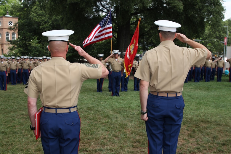 Sgt. Maj. Jonathan W. Clark and Maj. Richard P. Neikirk, commanding officer of Recruiting Station Raleigh, salute colors during the conclusion of a relief and appointment ceremony June 30 at the North Carolina State University Memorial Bell Tower, NC. Clark relieved Sgt. Maj. Jim E. Lanham who is to report to Okinawa, Japan, as the 31st Marine Expeditionary Unit sergeant major. (U.S. Marine Corps photo by Sgt. Antonio J. Rubio/Released)