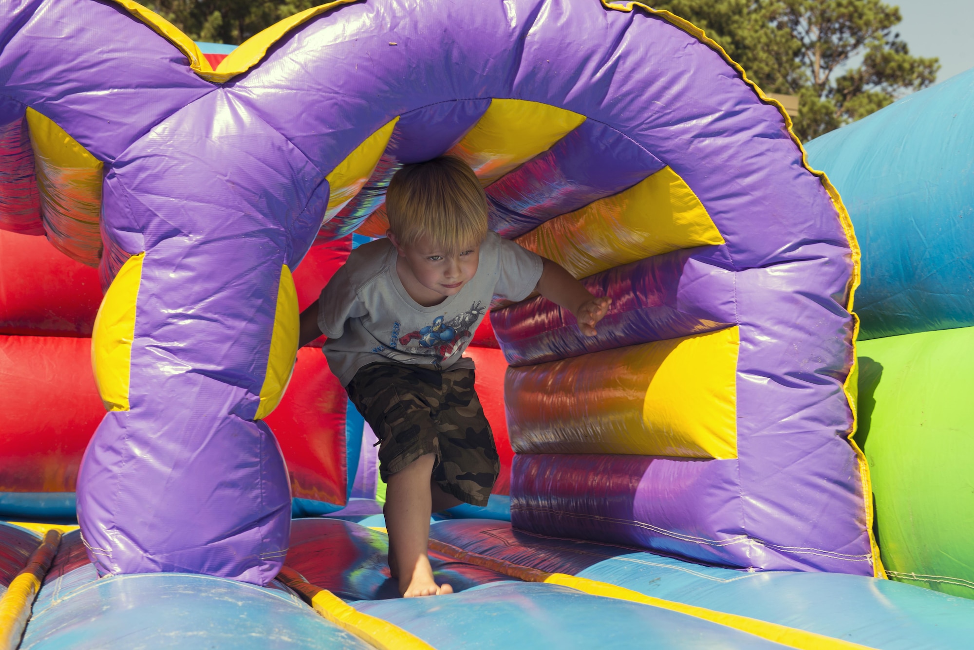 Wyatt Rogers, son of U.S. Air Force Staff Sgt. Len Rogers, 23d Civil Engineer Squadron, maneuvers through an obstacle course at the End of Summer Bash, July 29, 2016, at Moody Air Force Base, Ga. The Airman and Family Readiness Center hosted the event, which was open to active duty members and their families, Moody civilian employees and retirees. (U.S. Air Force photo by Airman 1st Class Greg Nash)