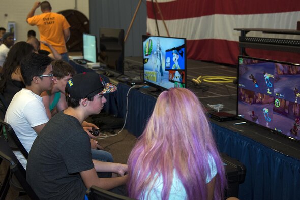 Participants from the base video game club and End of Summer Bash attendees compete in video game night, July 29, 2016, at Moody Air Force Base, Ga. The club provides gamers the opportunity to unite and compete through gaming. (U.S. Air Force photo by Airman 1st Class Greg Nash)
