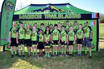 Steve Goolsby poses with the NICA biking team he mentors.