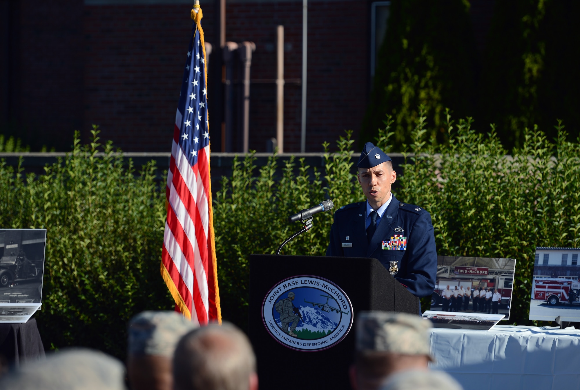 Lt. Col. Michael Francis, 627th Civil Engineer Squadron commander, recognizes Air Force firefighters who have served at McChord Field, during a memorial ceremony July 26, 2016, at Joint Base Lewis-McChord, Wash. Air Force firefighters have served at McChord since 1946 and will no longer be assigned to JBLM by July 2017. (U.S. Air Force photo/Senior Airman Jacob Jimenez)      