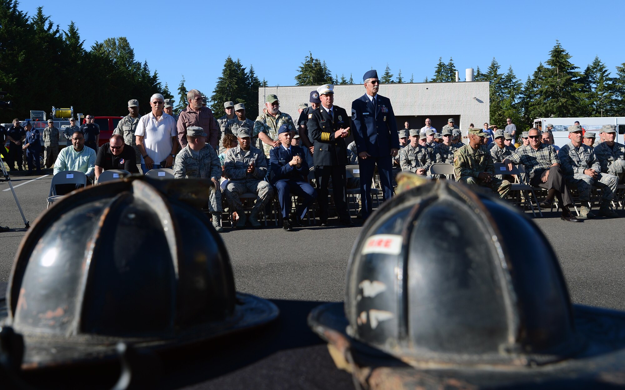 Active duty and retired Air Force firefighters at McChord Field receive recognition for their service during a memorial ceremony July 26, 2016, at Joint Base Lewis-McChord, Wash. The ceremony commemorated the service of Air Force firefighters that have served at JBLM and concluded Air Force firefighter’s service before they are reassigned. (U.S. Air Force photo/Senior Airman Jacob Jimenez) 