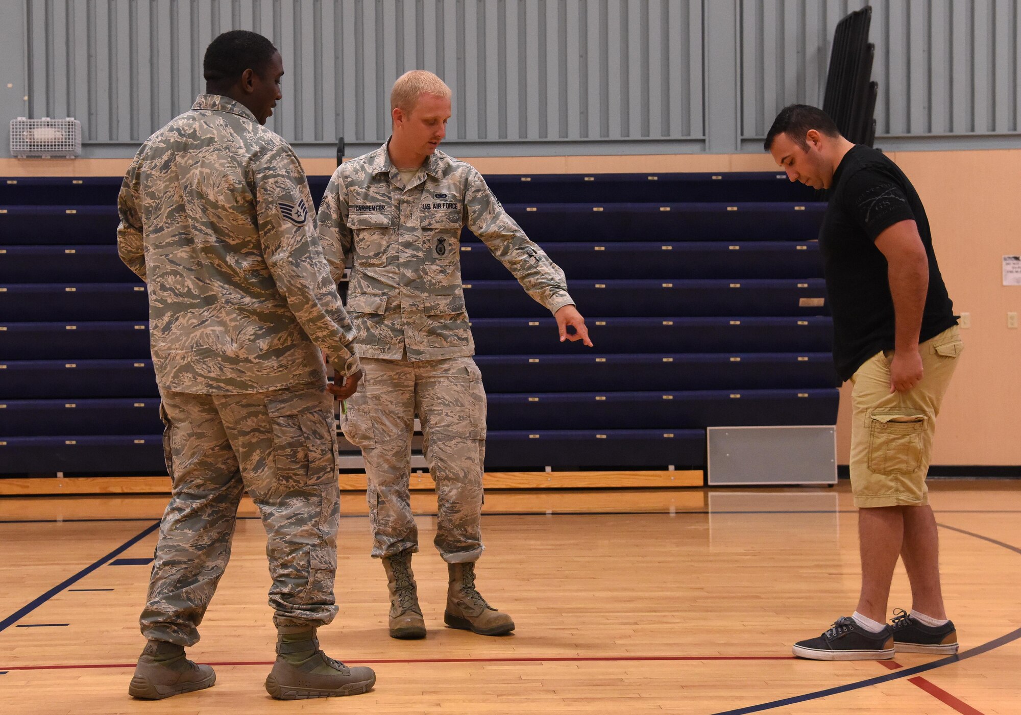 Members of the 341st Security Forces Squadron participate in a live standardized field sobriety test July 28, 2016, at Malmstrom Air Force Base, Mont. The SFST consisted of three tests performed during a traffic stop to determine if a driver is impaired, and once completed the students are able to practice nationwide. (U.S. Air Force photo/Senior Airman Jaeda Tookes)