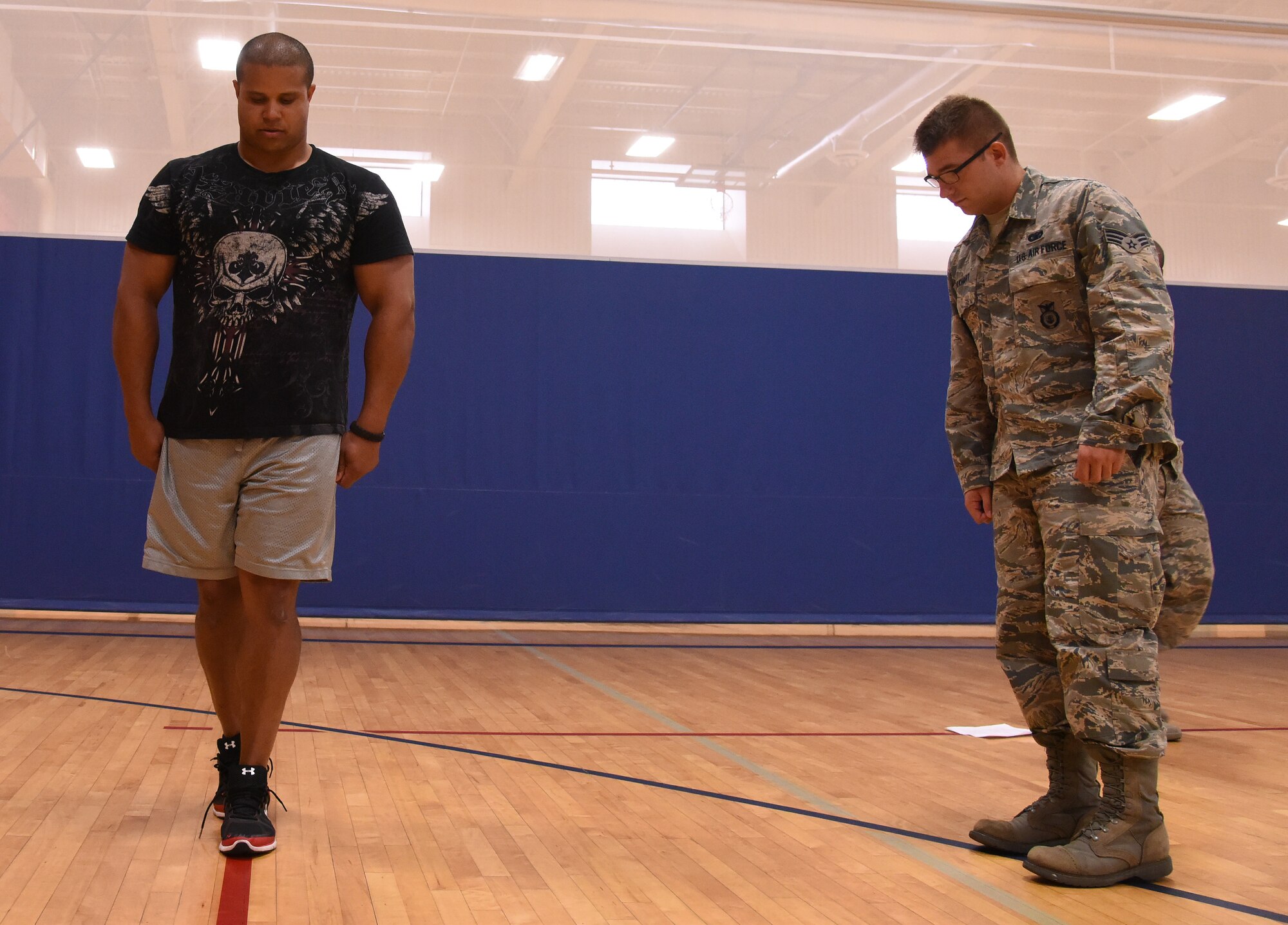 Members of the 341st Security Forces Squadron participate in a live standardized field sobriety test July 28, 2016, at Malmstrom Air Force Base, Mont. Members completed five days of classroom training to receive their lifetime National Highway Traffic Safety Administration certification from the United States government, allowing them to conduct SFST nationwide. (U.S. Air Force photo/Senior Airman Jaeda Tookes)