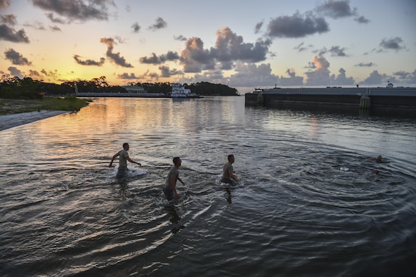 Air Force ROTC cadets wade into the water during a physical training competition --called a "monster mash"-- at a Special Tactics orientation course at Hurlburt Field, Fla., July 29, 2016. Run twice a summer by the 24th Special Operations Wing, 48 cadets spent a week learning what it takes to become a Special Tactics officer. (U.S. Air Force photo by Senior Airman Ryan Conroy) 