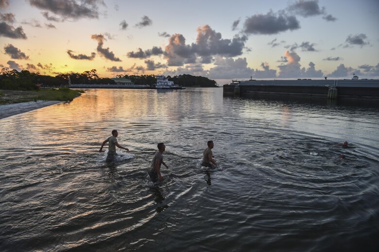 Air Force ROTC cadets wade into the water during a physical training competition --called a "monster mash"-- at a Special Tactics orientation course at Hurlburt Field, Fla., July 29, 2016. Run twice a summer by the 24th Special Operations Wing, 48 cadets spent a week learning what it takes to become a Special Tactics officer. (U.S. Air Force photo by Senior Airman Ryan Conroy) 