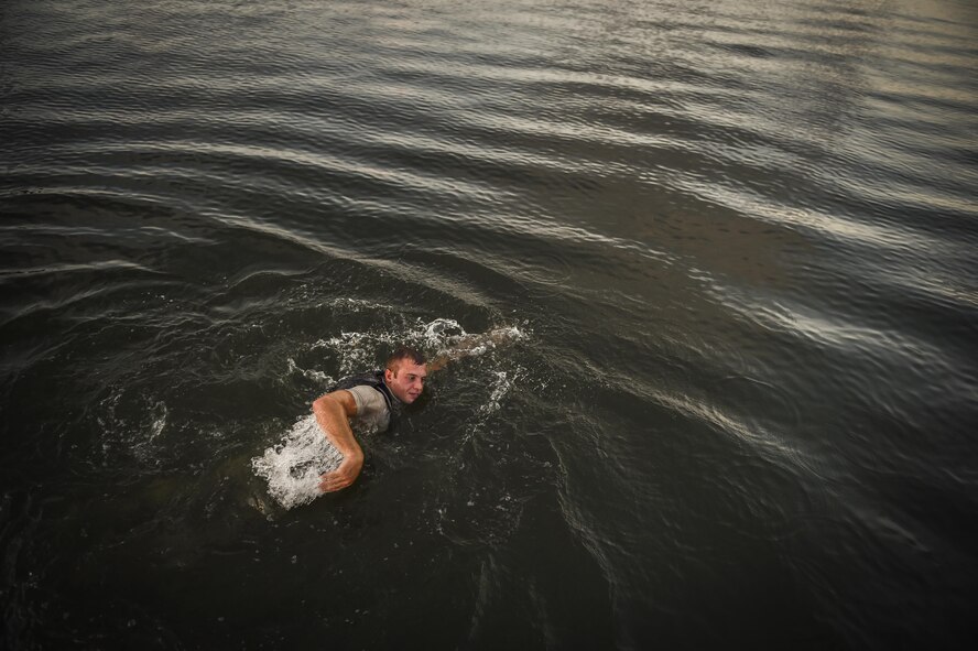 An ROTC cadet swims during a physical training competition --called a "monster mash"-- at a Special Tactics orientation course at Hurlburt Field, Fla., July 29, 2016. Run twice a summer by the 24th Special Operations Wing, 48 cadets spent a week learning what it takes to become a Special Tactics officer. (U.S. Air Force photo by Senior Airman Ryan Conroy)