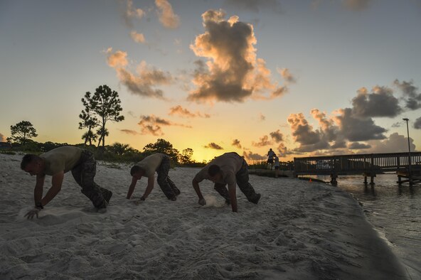 Air Force ROTC cadets bear-crawl during a physical training competition --called a "monster mash"-- at a Special Tactics orientation course at Hurlburt Field, Fla., July 29, 2016. Run twice a summer by the 24th Special Operations Wing, 48 cadets spent a week learning what it takes to become a Special Tactics officer. (U.S. Air Force photo by Senior Airman Ryan Conroy)