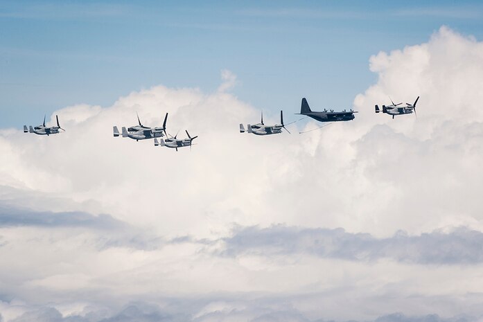 U.S. Marine Corps MV-22 Ospreys assigned to Marine Medium Tiltrotor Squadron 265, Marine Corps Air Station Futenma, Japan, fly in formation with a U.S. Air Force MC-130J Commando II assigned to the 17th Special Operations Squadron, Kadena Air Base, Japan, during a tiltrotor air to air refueling (TAAR) July 19, 2016, over the Pacific Ocean. The TAAR enabled the Ospreys to operate beyond unassisted flight range in a training exercise designed to evaluate long-range airfield seizure capability in a joint operation between the Marines and Air Force. 