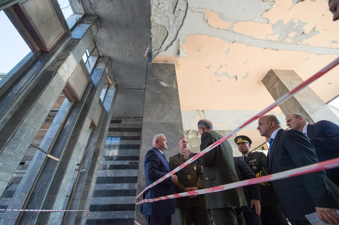Marine Corps Gen. Joe Dunford, chairman of the Joint Chiefs of Staff, tours parts of the Turkish Grand National Assembly that were destroyed during the failed July 15 coup attempt while accompanied by Gen. Hulusi Akar, chief of the Turkish General Staff, in Ankara, Turkey, Aug. 1, 2016. DoD photo by Navy Petty Officer 2nd Class Dominique A. Pineiro