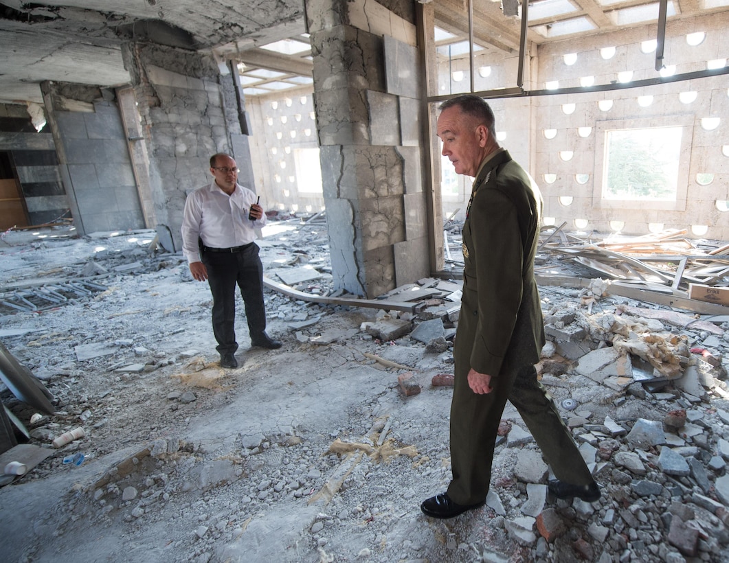 Marine Corps Gen. Joe Dunford, chairman of the Joint Chiefs of Staff, tours parts of the Turkish Grand National Assembly that were destroyed during the failed July 15 coup attempt in Ankara, Turkey, Aug. 1, 2016. DoD photo by Navy Petty Officer 2nd Class Dominique A. Pineiro