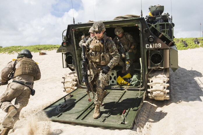 U.S. Marines with Company E, Battalion Landing Team 2nd Battalion, 3rd Marine Regiment, exit an Assault Amphibious Vehicle to assault a beach during Rim of the Pacific 2016. The assault was launched from USS San Diego and commanded by III Marine Expeditionary Force units aboard USS America.Twenty-six nations, more than 40 ships and submarines, more than 200 aircraft and 25,000 personnel are participating in RIMPAC from June 30 to Aug. 4, in and around the Hawaiian Islands and Southern California. The world's largest international maritime exercise, RIMPAC provides a unique training opportunity that helps participants foster and sustain the cooperative relationships that are critical to ensuring the safety of sea lanes and security in the world's oceans. RIMPAC 2016 is the 25th exercise in the series that began in 1971.