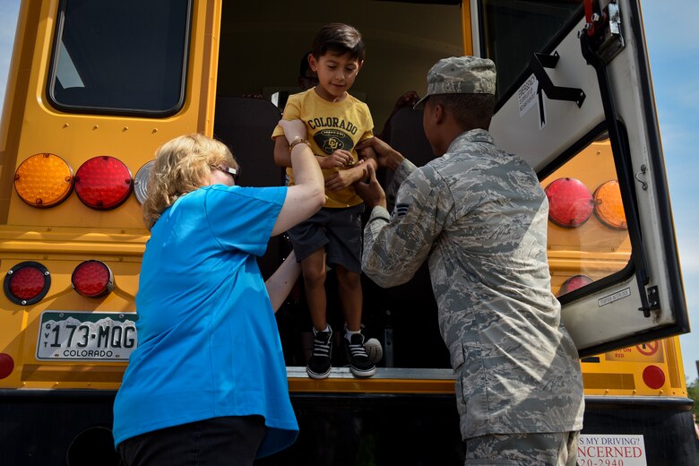 PETERSON AIR FORCE BASE, Colo. – Alex, a student at the R.P. Lee Youth Center, learns how to exit a school bus properly during an evacuation drill as part of the Buster the Bus Safety Event at the base auditorium on Peterson Air Force Base, Colo., July 26, 2016. The event taught kids how to properly use seat belts on the bus, evacuate safely and how to ride the bus to and from school. (U.S. Air Force photo by Senior Airman Rose Gudex)