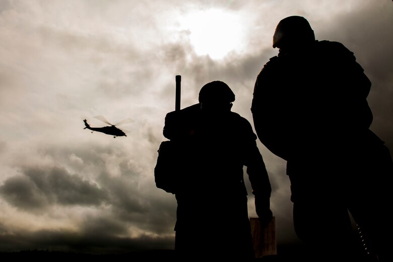 U.S. Marines with Marine Wing Support Squadron (MWSS) 171 stationed at Marine Corps Air Station Iwakuni, Japan, guide in a MH-60S Seahawk with Helicopter Sea Combat Squadron (HSC) 25 to attack a simulated enemy during Exercise Eagle Wrath 2016 at Combined Arms Training Center Camp Fuji, July 28, 2016. During the exercises culminating event, Marines established a mock air base including a landing zone and refueling point, constructed defensive and machine-gun positions, and conducted convoys and patrols over the course of four days. Known as ‘America’s Squadron,’ MWSS-171 received assistance throughout the exercise from Combat Logistics Company 36 from MCAS Iwakuni, the Low Altitude Air Defense Battalion and Marine Air Traffic Control Mobile Team from the 31st Marine Expeditionary Unit, and HSC-25 from Andersen Air Force Base, Guam. (U.S. Marine Corps photo by Lance Cpl. Aaron Henson)
