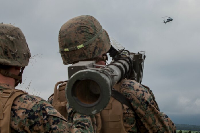 U.S. Marine Corps Cpl. Johnston Murn, a low altitude air defense gunner with 3rd LAAD Battalion unit deployment program, uses a Stinger missile tracking and handling trainer on a Sikorsky MH-60S Seahawk with Helicopter Sea Combat Squadron (HSC) 25 during Exercise Eagle Wrath 2016 at Combined Arms Training Center Camp Fuji, July 28, 2016. Marine Wing Support Squadron 171 stationed at Marine Corps Air Station Iwakuni, Japan, received assistance throughout the exercise from Combat Logistics Company 36 from MCAS Iwakuni, the Low Altitude Air Defense Battalion and Marine Air Traffic Control Mobile Team from the 31st Marine Expeditionary Unit and HSC-25 from Andersen Air Force Base, Guam. (U.S. Marine Corps photo by Lance Cpl. Aaron Henson)