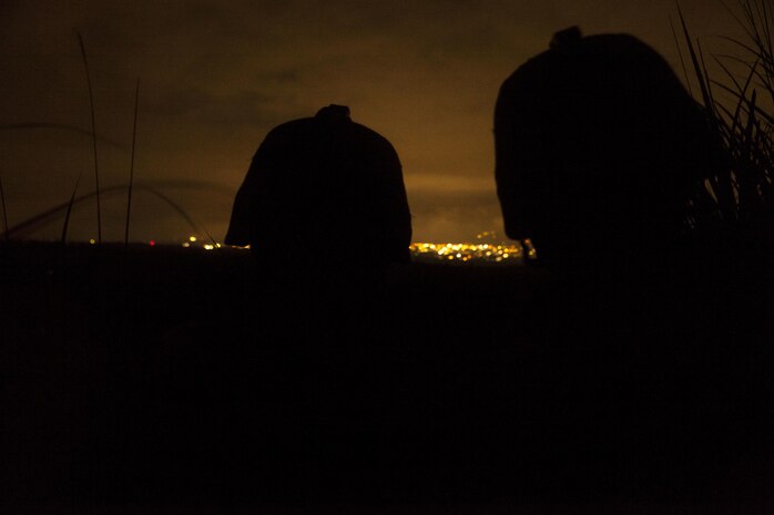 U.S. Marines with Marine Wing Support Squadron (MWSS) 171 stationed at Marine Corps Air Station Iwakuni, Japan, watch the perimeter of the forward operating base during Exercise Eagle Wrath 2016 at Combined Arms Training Center Camp Fuji, July 28, 2016. During the culminating event, Marines established a mock air base including a landing zone and refueling point, constructed defensive and machine-gun positions, and conducted convoys and patrols over the course of four days. MWSS-171 conducts this exercise once a year in order to train all the Marines within the squadron, enhance their technical skills, field experience and military occupational specialty capability. (U.S. Marine Corps photo by Lance Cpl. Aaron Henson)