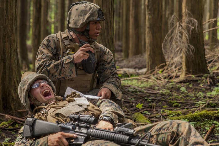 U.S. Marine Corps Cpl. Christian Marin, a heavy equipment mechanic with Marine Wing Support Squadron (MWSS) 171 stationed at Marine Corps Air Station Iwakuni, Japan, radios-in a simulated casualty during Exercise Eagle Wrath 2016 at Combined Arms Training Center Camp Fuji, July 28, 2016. During the culminating event, Marines established a mock air base including a landing zone and refueling point, constructed defensive and machine-gun positions, and conducted convoys and patrols over the course of four days. MWSS-171 conducts this exercise once a year in order to train all the Marines within the squadron, enhance their technical skills, field experience and military occupational specialty capability. (U.S. Marine Corps photo by Lance Cpl. Aaron Henson)