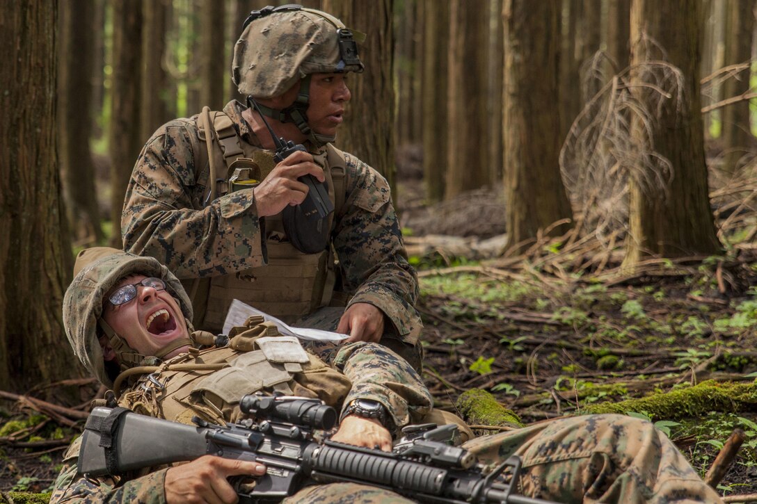 U.S. Marine Corps Cpl. Christian Marin, a heavy equipment mechanic with Marine Wing Support Squadron (MWSS) 171 stationed at Marine Corps Air Station Iwakuni, Japan, radios-in a simulated casualty during Exercise Eagle Wrath 2016 at Combined Arms Training Center Camp Fuji, July 28, 2016. During the culminating event, Marines established a mock air base including a landing zone and refueling point, constructed defensive and machine-gun positions, and conducted convoys and patrols over the course of four days. MWSS-171 conducts this exercise once a year in order to train all the Marines within the squadron, enhance their technical skills, field experience and military occupational specialty capability. (U.S. Marine Corps photo by Lance Cpl. Aaron Henson)